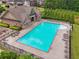 Aerial view of the pool and pool house in a well maintained community at 5068 Bentwater Sw Ln, Lilburn, GA 30047