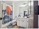White bathroom featuring a patterned shower curtain, vanity, and tile flooring at 5068 Bentwater Sw Ln, Lilburn, GA 30047