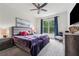 Cozy bedroom with plush carpet, a large window, and stylish decor at 5068 Bentwater Sw Ln, Lilburn, GA 30047