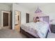 Bedroom with a bed, nightstand, and door leading to a bathroom at 5068 Bentwater Sw Ln, Lilburn, GA 30047