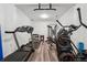 Home gym featuring a treadmill, elliptical, weight rack and multi-station workout machine at 5068 Bentwater Sw Ln, Lilburn, GA 30047