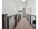 Hallway with hardwood floors and railing at 5068 Bentwater Sw Ln, Lilburn, GA 30047