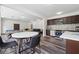 Open kitchen and living area with stainless appliances and dining space, plus a pool table at 5068 Bentwater Sw Ln, Lilburn, GA 30047