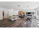 Open floor plan featuring a spacious living room with a pool table and a partial kitchen at 5068 Bentwater Sw Ln, Lilburn, GA 30047
