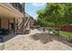 Backyard patio with a stone paver patio, stairs to the deck, and an outdoor lounge area at 5068 Bentwater Sw Ln, Lilburn, GA 30047