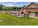 Community playground with swings, slide, and climbing structure, perfect for Gathering fun at 5068 Bentwater Sw Ln, Lilburn, GA 30047