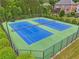Well maintained community tennis courts with new blue surface for hours of enjoyment at 5068 Bentwater Sw Ln, Lilburn, GA 30047