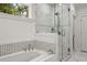 Luxurious bathroom featuring a soaking tub and separate glass-enclosed shower at 770 Ormewood Se Ave, Atlanta, GA 30312