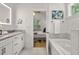 Bright bathroom with double sink vanity and soaking tub, adjacent to the bedroom at 770 Ormewood Se Ave, Atlanta, GA 30312
