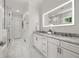 Modern bathroom with double vanity, marble countertops, and glass-enclosed shower at 770 Ormewood Se Ave, Atlanta, GA 30312