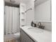 Bright bathroom features a modern vanity, sink, and shower with stylish fixtures at 770 Ormewood Se Ave, Atlanta, GA 30312