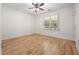 Bedroom with hardwood floors and large window with natural lighting at 770 Ormewood Se Ave, Atlanta, GA 30312