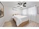Serene bedroom with a ceiling fan, and soft natural light, creating a peaceful and inviting space at 770 Ormewood Se Ave, Atlanta, GA 30312
