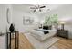 Bedroom with hardwood floors, a ceiling fan, and a window offering plenty of natural light at 770 Ormewood Se Ave, Atlanta, GA 30312