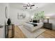 Well-lit bedroom with hardwood floors, ceiling fan, and a comfortable queen-sized bed at 770 Ormewood Se Ave, Atlanta, GA 30312