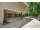 Spacious carport providing ample covered parking and convenient access to storage rooms, ideal for a home-based business at 770 Ormewood Se Ave, Atlanta, GA 30312