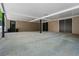 Large carport features multiple storage rooms and black support beams, offering practical outdoor space and shelter for vehicles at 770 Ormewood Se Ave, Atlanta, GA 30312