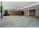 Open carport offers convenient shelter, leading to multiple storage doors at 770 Ormewood Se Ave, Atlanta, GA 30312