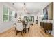Elegant dining room showcasing hardwood floors, stylish lighting, and ample seating for entertaining at 770 Ormewood Se Ave, Atlanta, GA 30312
