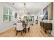 Spacious dining room featuring modern lighting, hardwood floors, and an open floor plan at 770 Ormewood Se Ave, Atlanta, GA 30312