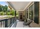 Relaxing front porch featuring stylish seating, dark trim and a view of the neighborhood at 770 Ormewood Se Ave, Atlanta, GA 30312