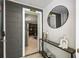 Stylish hallway with modern decor, including a sleek console table, decorative accents, and a glimpse of the living area at 770 Ormewood Se Ave, Atlanta, GA 30312