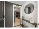 Entryway features a stylish console table, mirror, and view into a modern living space at 770 Ormewood Se Ave, Atlanta, GA 30312
