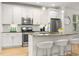 Bright kitchen featuring granite countertops, stainless appliances, and counter seating at 770 Ormewood Se Ave, Atlanta, GA 30312