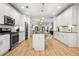 Modern kitchen featuring stainless steel appliances, white cabinets, and a kitchen island at 770 Ormewood Se Ave, Atlanta, GA 30312
