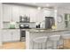 Bright kitchen with a center island, stainless steel appliances, and white cabinetry at 770 Ormewood Se Ave, Atlanta, GA 30312