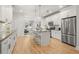 Stylish kitchen with stainless steel appliances, white cabinetry, and an open layout at 770 Ormewood Se Ave, Atlanta, GA 30312