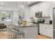 Modern kitchen with stainless steel appliances, granite countertops, and an island with seating at 770 Ormewood Se Ave, Atlanta, GA 30312