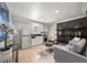 Open living space includes a compact kitchen, modern appliances, and cozy seating at 770 Ormewood Se Ave, Atlanta, GA 30312