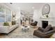 Bright living room featuring hardwood floors, a fireplace, and neutral tones for a modern and inviting feel at 770 Ormewood Se Ave, Atlanta, GA 30312