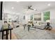 Sun-filled living room featuring hardwood floors, neutral tones, stylish decor, and an open layout at 770 Ormewood Se Ave, Atlanta, GA 30312