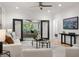 Well lit living room boasting recessed lights, stylish decor, hardwood flooring and a large flat screen TV at 770 Ormewood Se Ave, Atlanta, GA 30312