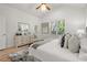 Serene main bedroom featuring hardwood floors, ensuite access, and bright windows at 770 Ormewood Se Ave, Atlanta, GA 30312