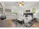Inviting main bedroom with vaulted ceiling, hardwood floors, bench and a large window at 770 Ormewood Se Ave, Atlanta, GA 30312