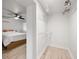 Well-organized walk-in closet with ample shelving and hanging space, adjacent to a bedroom with modern ceiling fan at 770 Ormewood Se Ave, Atlanta, GA 30312