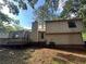 Home featuring an exterior deck and a private backyard at 1090 Forest Path, Stone Mountain, GA 30088