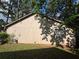The exterior of the home is beige with a small yard at 1090 Forest Path, Stone Mountain, GA 30088