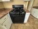 The kitchen boasts a freestanding Hotpoint range with a black finish at 1090 Forest Path, Stone Mountain, GA 30088