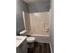 Bathroom with a tub/shower combination and updated fixtures at 1201 Saint Andrews Dr, Auburn, GA 30011