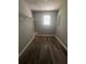 Walk-in closet featuring updated floors and ample storage space at 1201 Saint Andrews Dr, Auburn, GA 30011