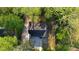 Birds-eye view of the house showcasing the roof and surrounding lush trees at 2228 Emory St, Covington, GA 30014