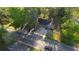 An aerial view of a charming home with a cozy porch and a well-maintained front yard at 2228 Emory St, Covington, GA 30014