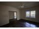 Empty bedroom featuring hardwood floors, white trim, and a window providing natural light at 2228 Emory St, Covington, GA 30014