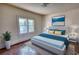 Staged bedroom with hardwood floors, a large window, and furniture at 2228 Emory St, Covington, GA 30014