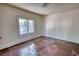 Bright bedroom featuring a large window and hardwood floors at 2228 Emory St, Covington, GA 30014