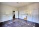 Bedroom featuring hardwood floors, white trim, and a door opening to another room at 2228 Emory St, Covington, GA 30014